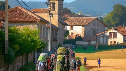 Pilgrims approaching the village of Palas De Rei, Spain, along the Camino Frances