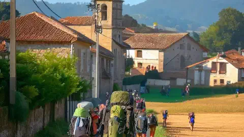 Pilgrims approaching the village of Palas De Rei, Spain, along the Camino Frances