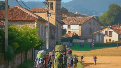 Pilgrims approaching the village of Palas De Rei, Spain, along the Camino Frances