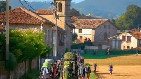 Pilgrims approaching the village of Palas De Rei, Spain, along the Camino Frances