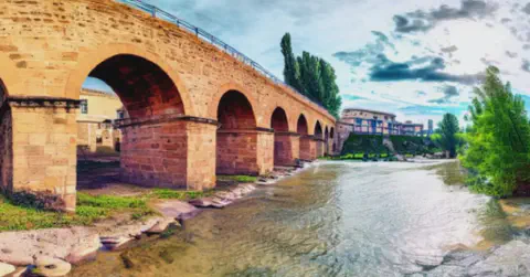 Artist’s Impression of The Queen’s Bridge over the river at Puente La Reina The Bridge Over The River At Puente La Reina